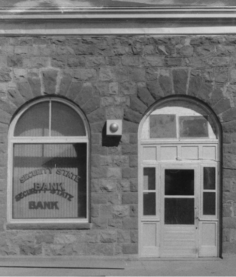 A black and white photo of a bank building